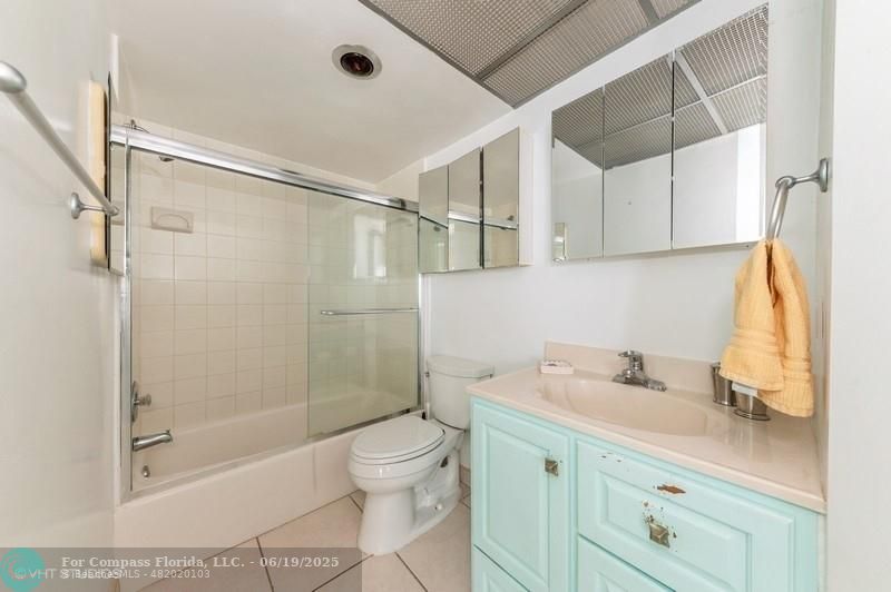 710 North Ocean Boulevard, Unit 1203 Pompano Beach, FL 33062 - Photo 13 of 23 a bathroom with a shower sink vanity and toilet