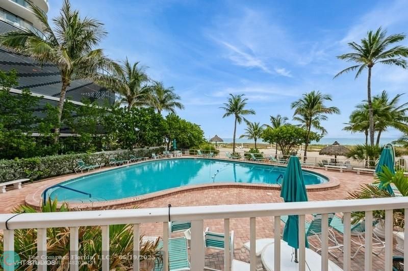 710 North Ocean Boulevard, Unit 1203 Pompano Beach, FL 33062 - Photo 18 of 23 a view of a swimming pool with a deck