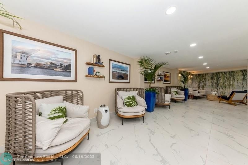 710 North Ocean Boulevard, Unit 1203 Pompano Beach, FL 33062 - Photo 5 of 23 a living room with furniture and a table