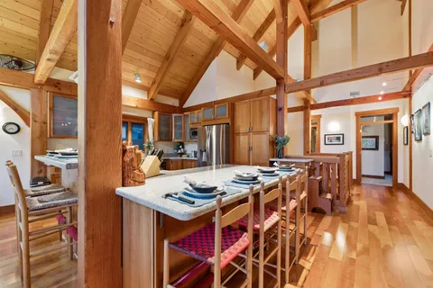 a dinning table and chairs in a room