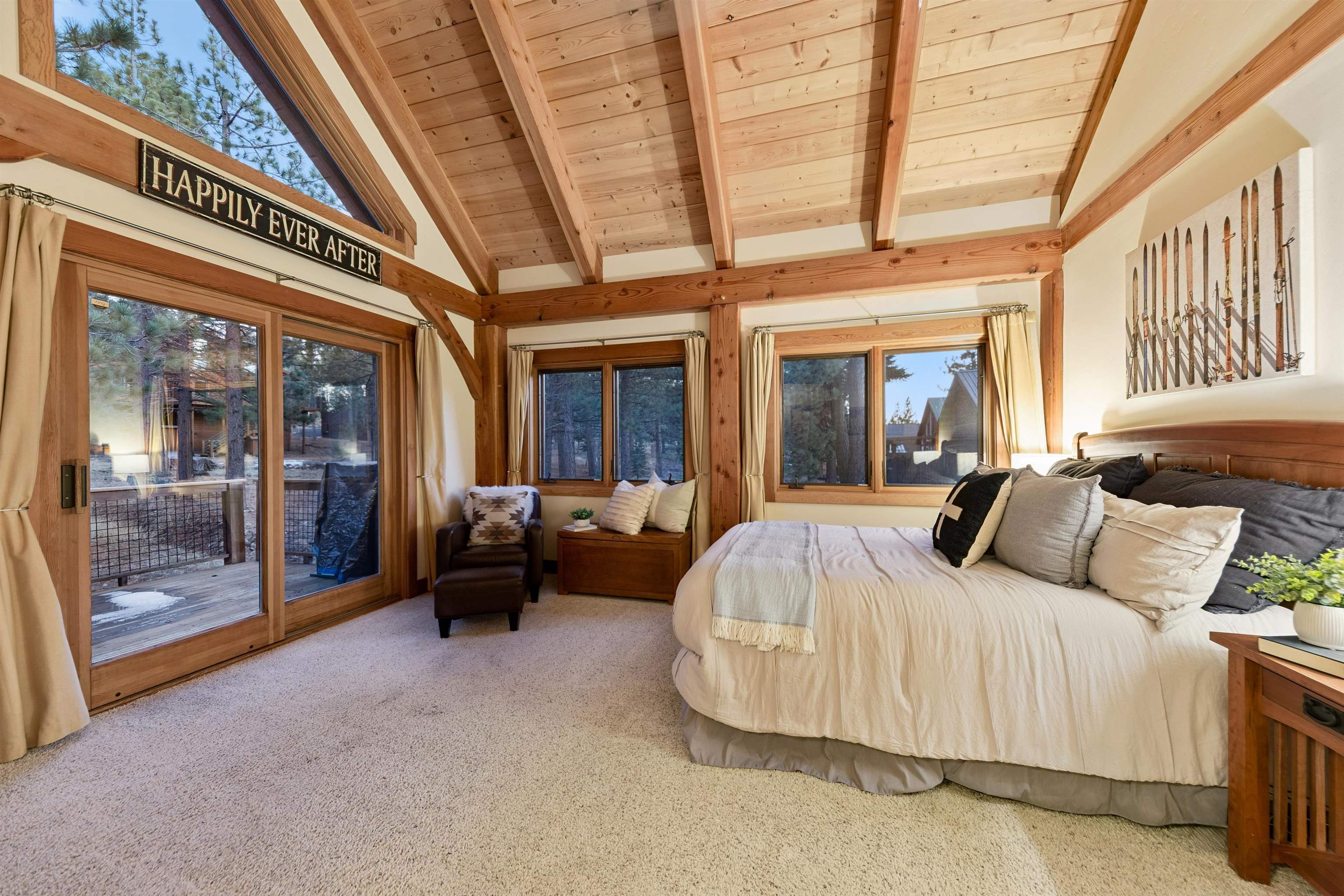 15075 Wolfgang Road Truckee, CA 96161 - Photo 18 of 28 a bedroom with furniture and large windows