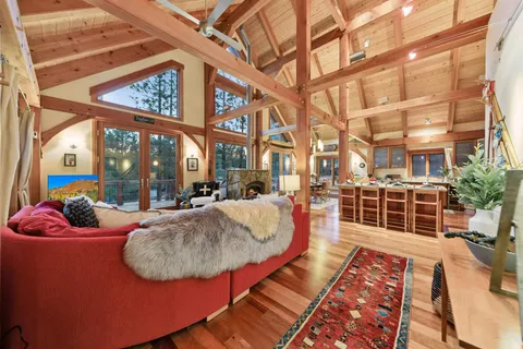 a view of a balcony with couch and wooden floor