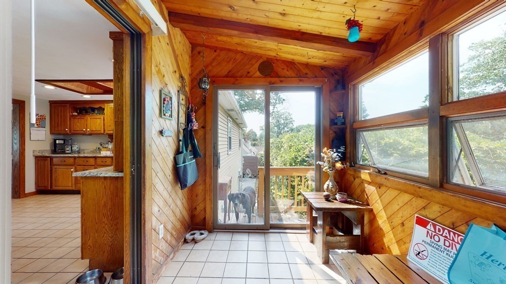 25 Charlton Road Dudley, MA 01571 - Photo 20 of 42 a view of an entryway with wooden floor and a livingroom view