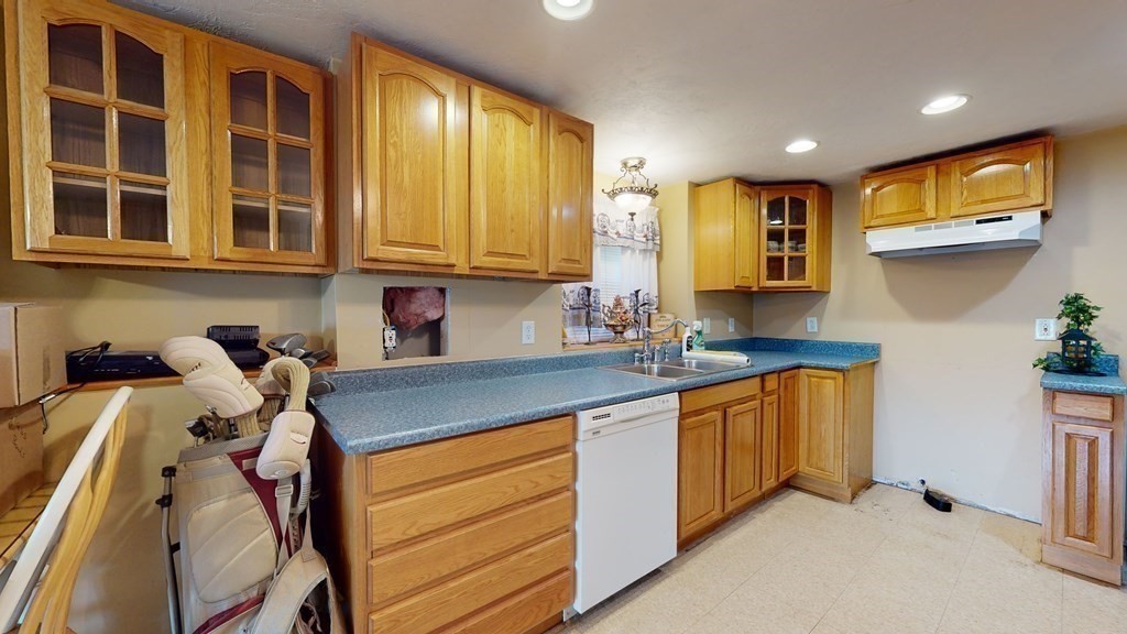25 Charlton Road Dudley, MA 01571 - Photo 32 of 42 a kitchen with stainless steel appliances granite countertop a sink and cabinets