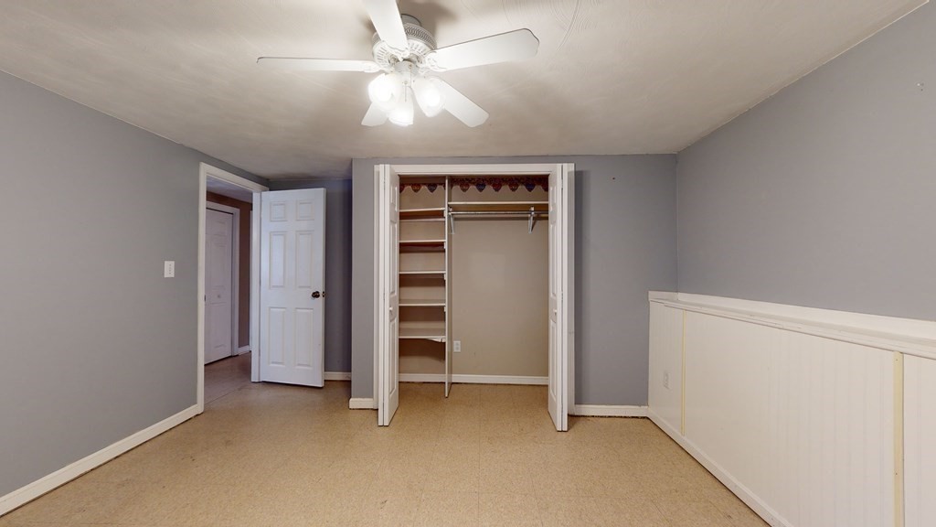 25 Charlton Road Dudley, MA 01571 - Photo 40 of 42 an empty room with closet and windows