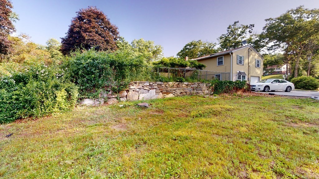 25 Charlton Road Dudley, MA 01571 - Photo 5 of 42 a view of backyard of the house