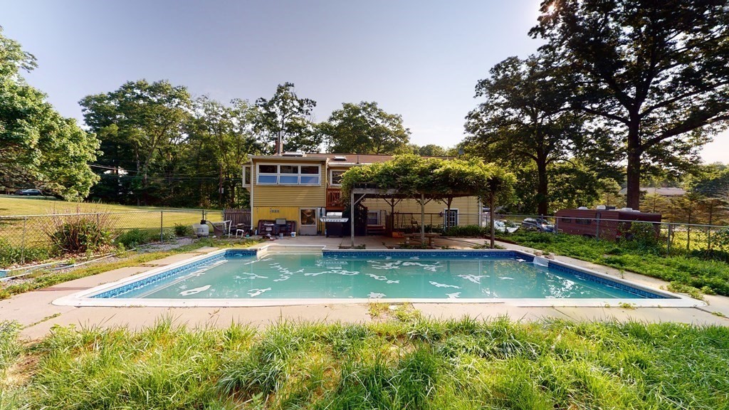 25 Charlton Road Dudley, MA 01571 - Photo 10 of 42 a view of a swimming pool with a patio