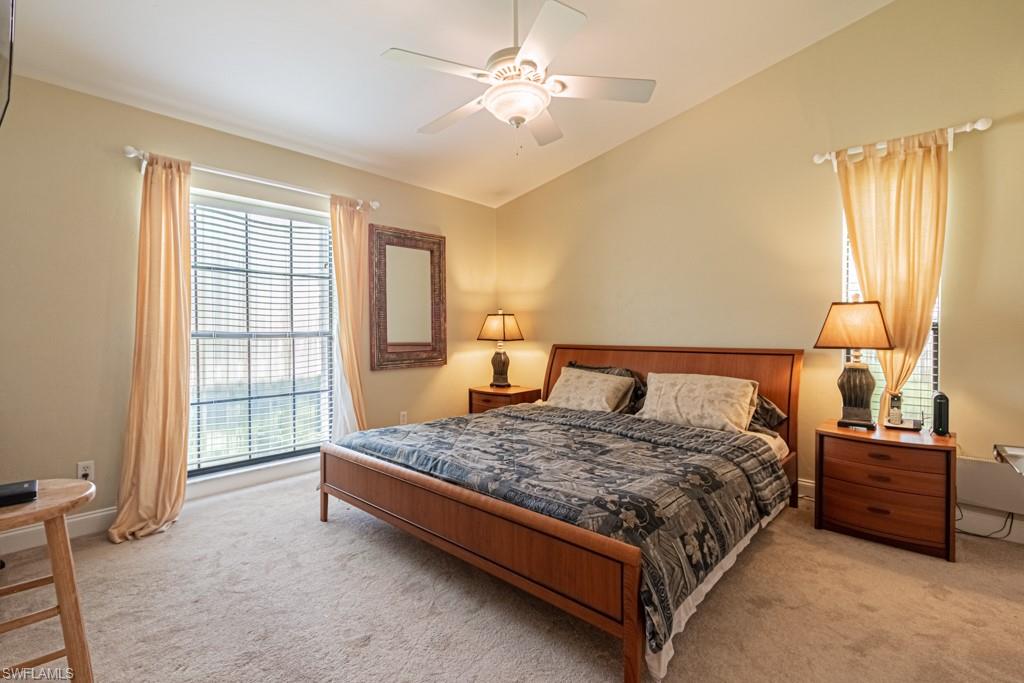 248 St James Way Naples, FL 34104 - Photo 19 of 34 a bedroom with a bed and window