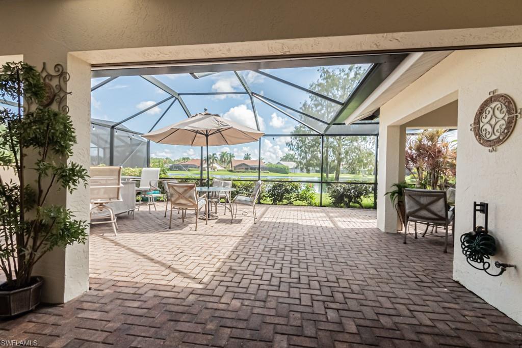 248 St James Way Naples, FL 34104 - Photo 26 of 34 a view of outdoor space with seating area