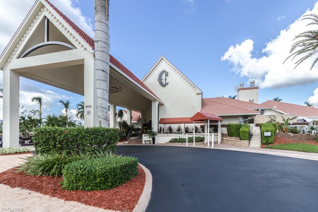 248 St James Way Naples, FL 34104 - Photo 32 of 34 a view of a building with a garden