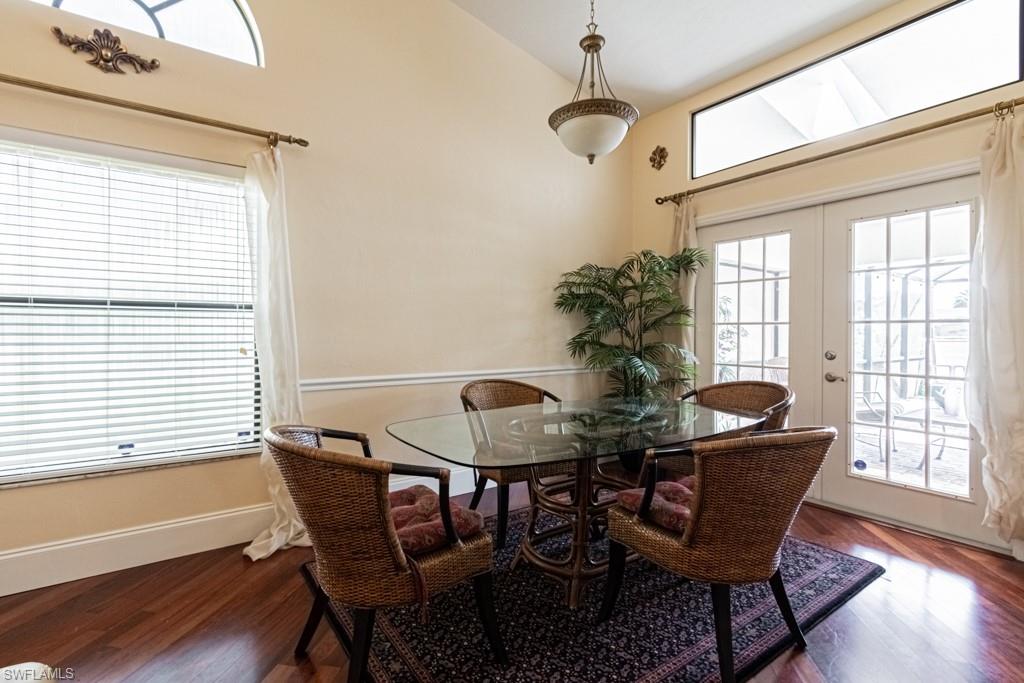 248 St James Way Naples, FL 34104 - Photo 4 of 34 a view of a dining room with furniture window and wooden floor