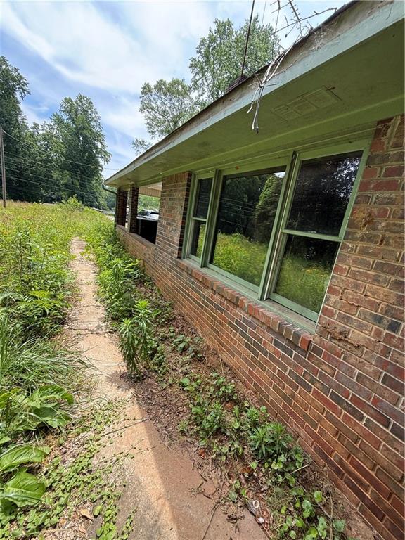 5075 Karr Road Cumming, GA 30040 - Photo 21 of 38 a front view of a house with garden