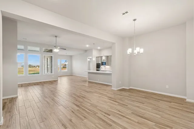 a kitchen with a sink dishwasher a fireplace with wooden floor