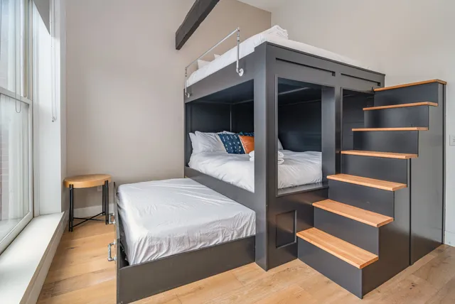 a bedroom with bed and walk in closet
