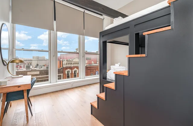 a view of an entryway with wooden floor and door