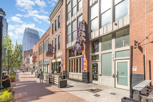 a city street lined with tall buildings