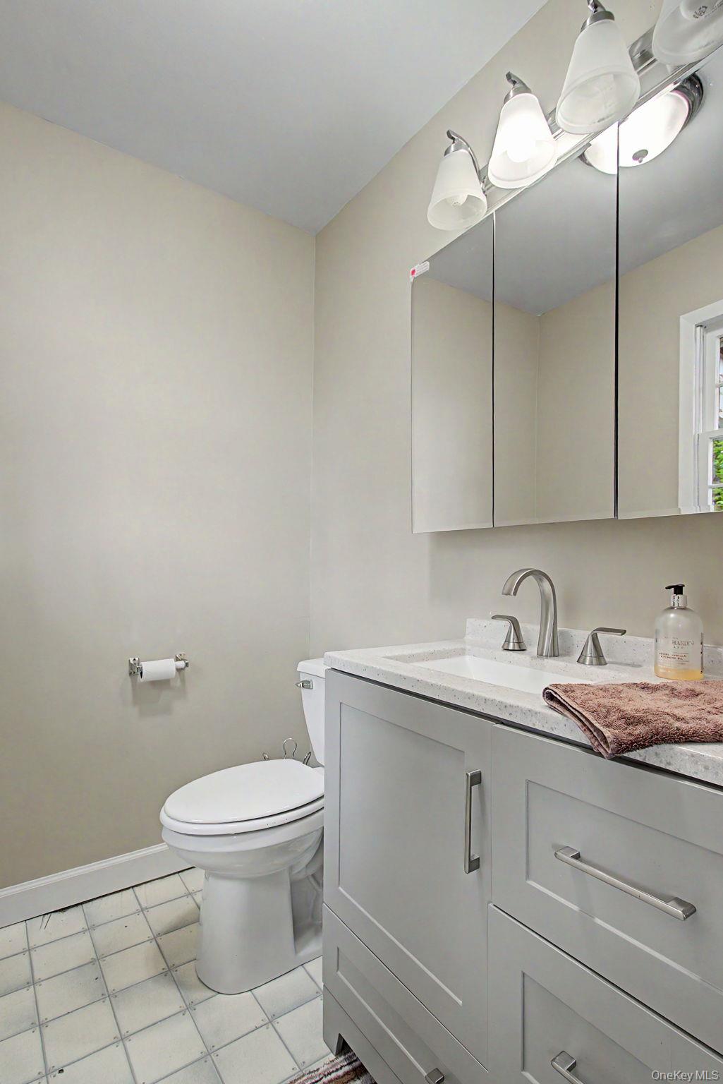 26 Garden Road Mahopac, NY 10541 - Photo 14 of 30 a bathroom with a granite countertop toilet sink and mirror