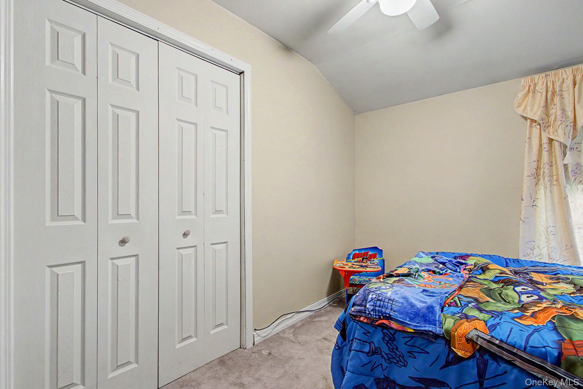 26 Garden Road Mahopac, NY 10541 - Photo 19 of 30 a bedroom with a bed and a window