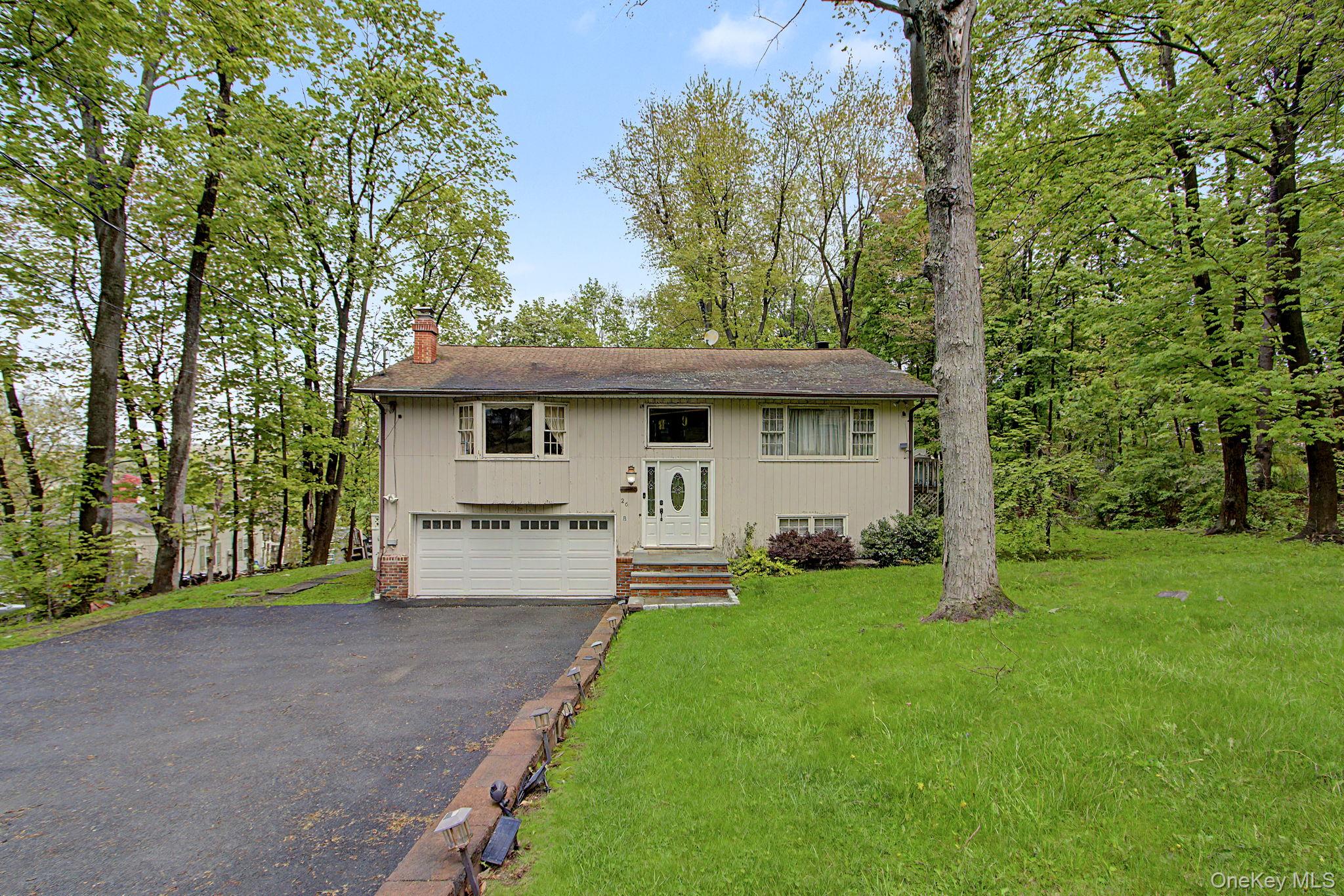 26 Garden Road Mahopac, NY 10541 - Photo 28 of 30 a view of a house with a yard and sitting area