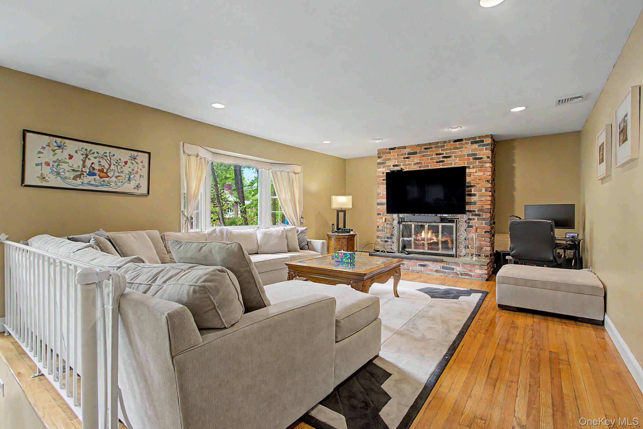 26 Garden Road Mahopac, NY 10541 - Photo 3 of 30 a living room with furniture and a flat screen tv