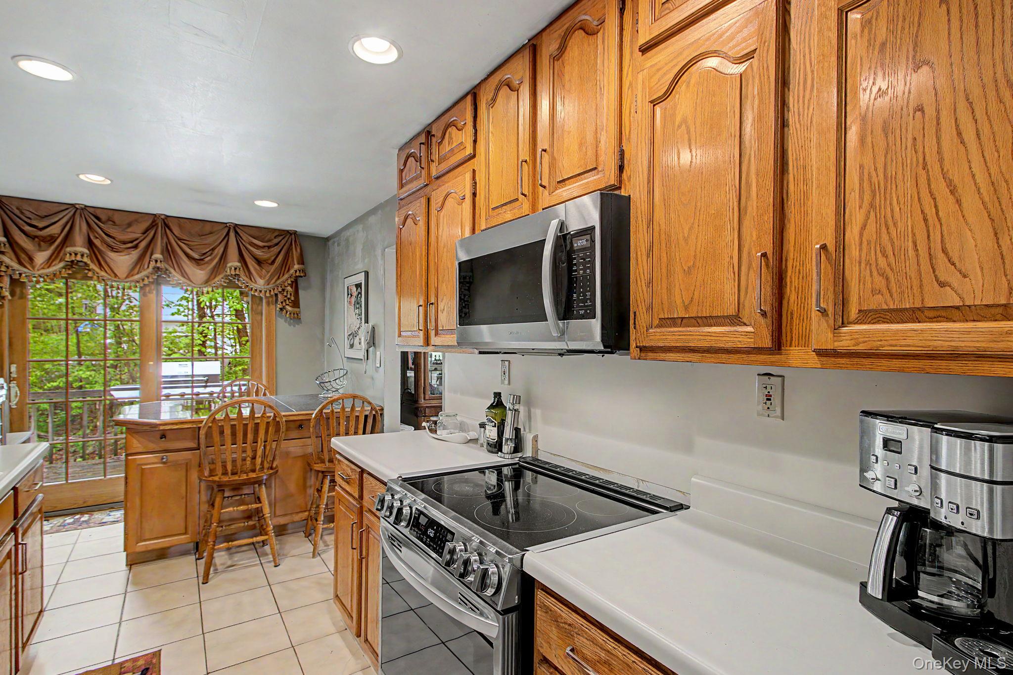 26 Garden Road Mahopac, NY 10541 - Photo 10 of 30 a kitchen that has a sink and a stove