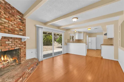 a kitchen with cabinets appliances and a window
