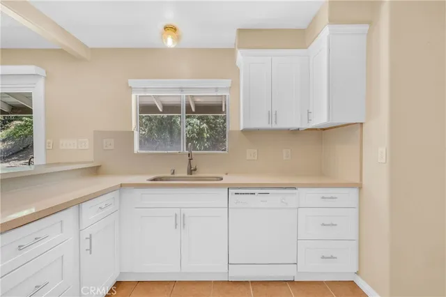 a bathroom with a sink a toilet and a shower