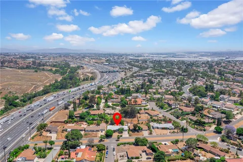 an aerial view of residential house with outdoor space and street view
