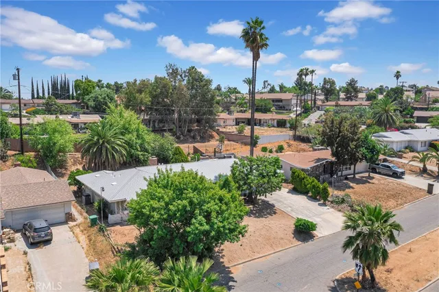 a view of a house with a tree in the background