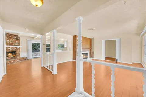 a view of an entryway with wooden floor