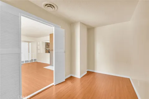 a view of hallway with wooden floor