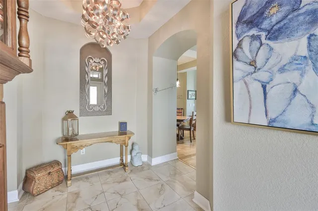 a view of a room with entryway front door and windows