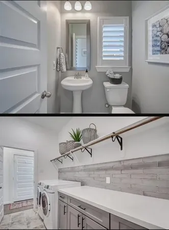 a view of bathroom with a potted plant on the counter and sink
