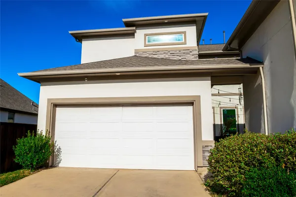 a view of a house with a garage