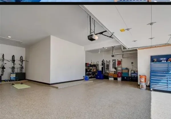 a view of a garage with rack and bicycle