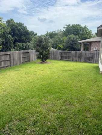 a view of a backyard with a small cabin