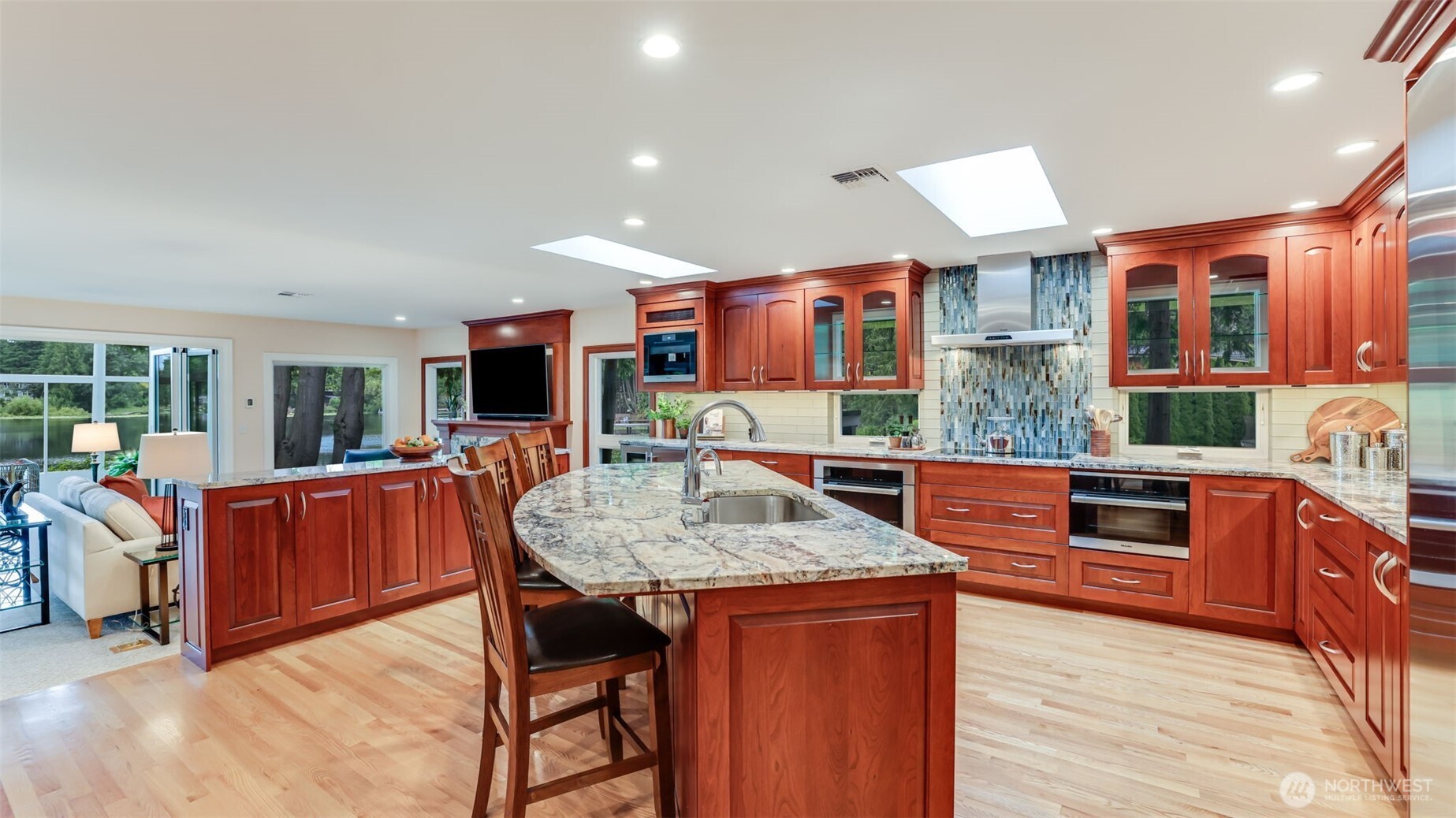 2171 North 122nd Place Seattle, WA 98133 - Photo 15 of 40 a kitchen with stainless steel appliances granite countertop a stove and a refrigerator