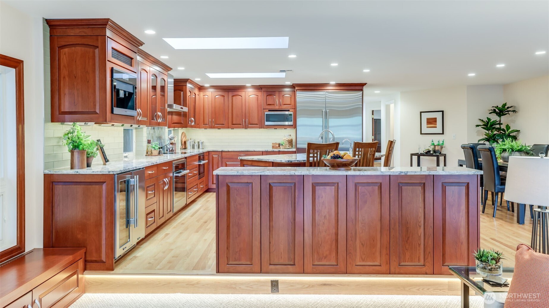 2171 North 122nd Place Seattle, WA 98133 - Photo 16 of 40 a open kitchen with stainless steel appliances granite countertop a refrigerator a stove and a wooden cabinets