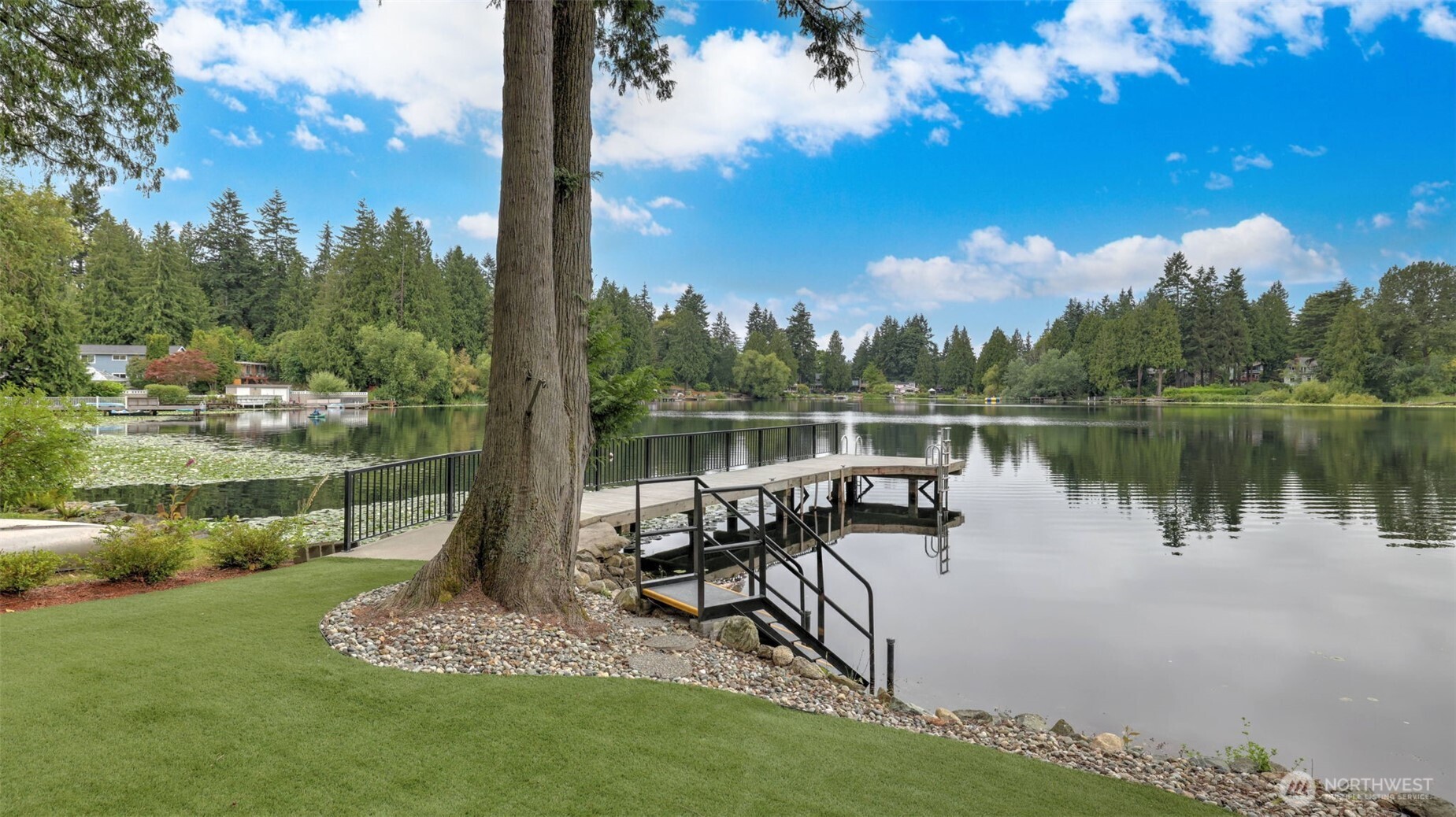 2171 North 122nd Place Seattle, WA 98133 - Photo 38 of 40 a view of a lake with a garden