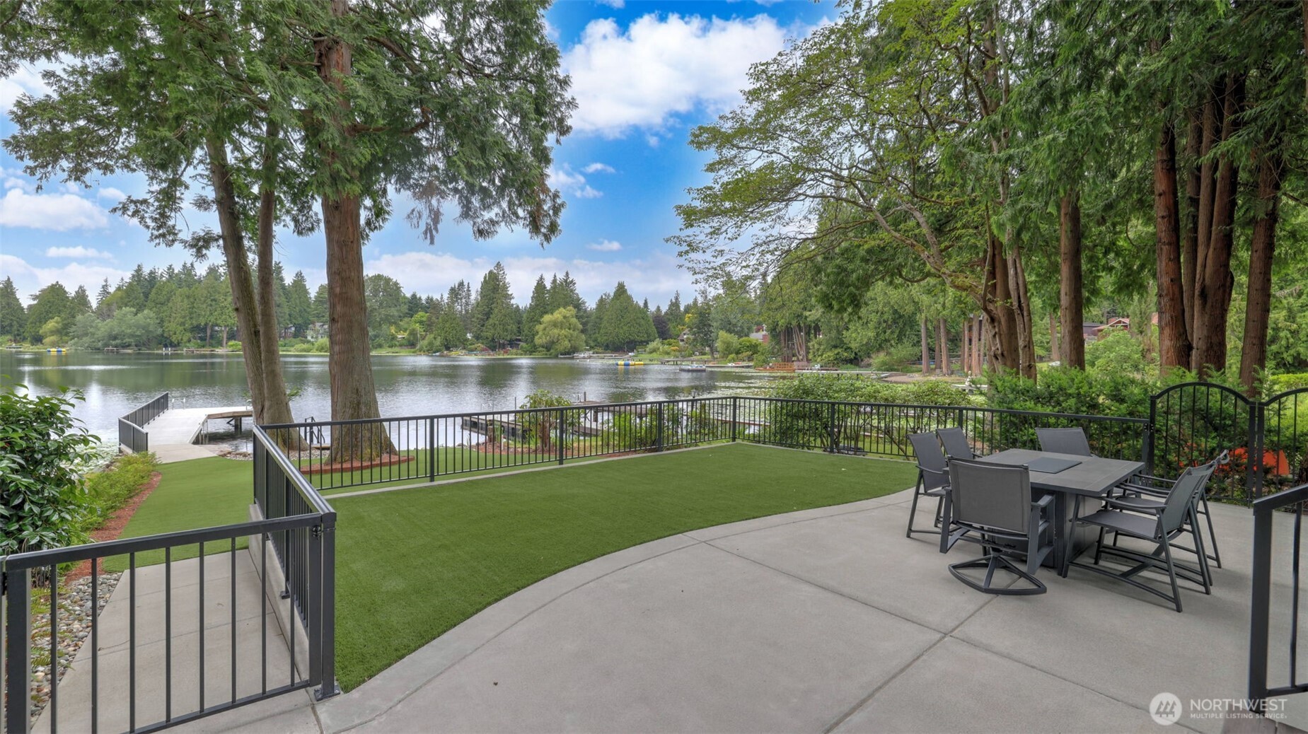 2171 North 122nd Place Seattle, WA 98133 - Photo 5 of 40 a view of a lake with a garden and trees