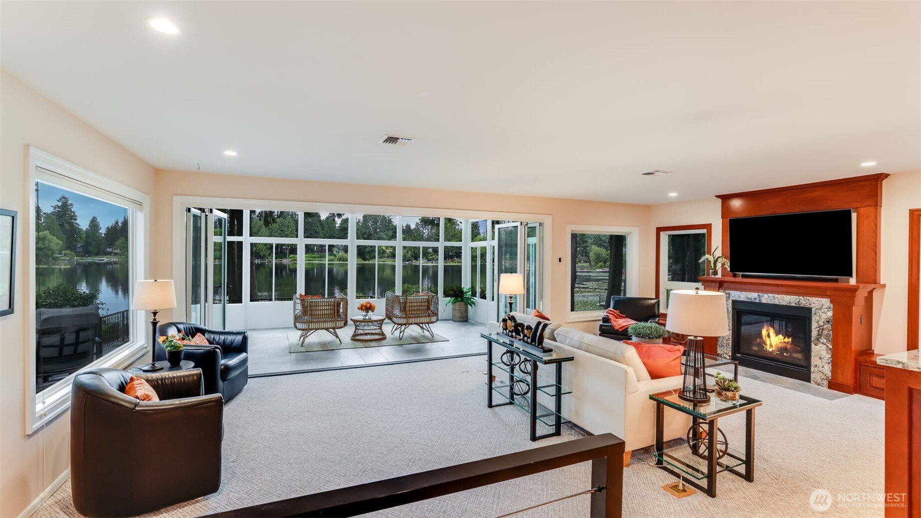 2171 North 122nd Place Seattle, WA 98133 - Photo 7 of 40 a living room with furniture a flat screen tv and a fireplace