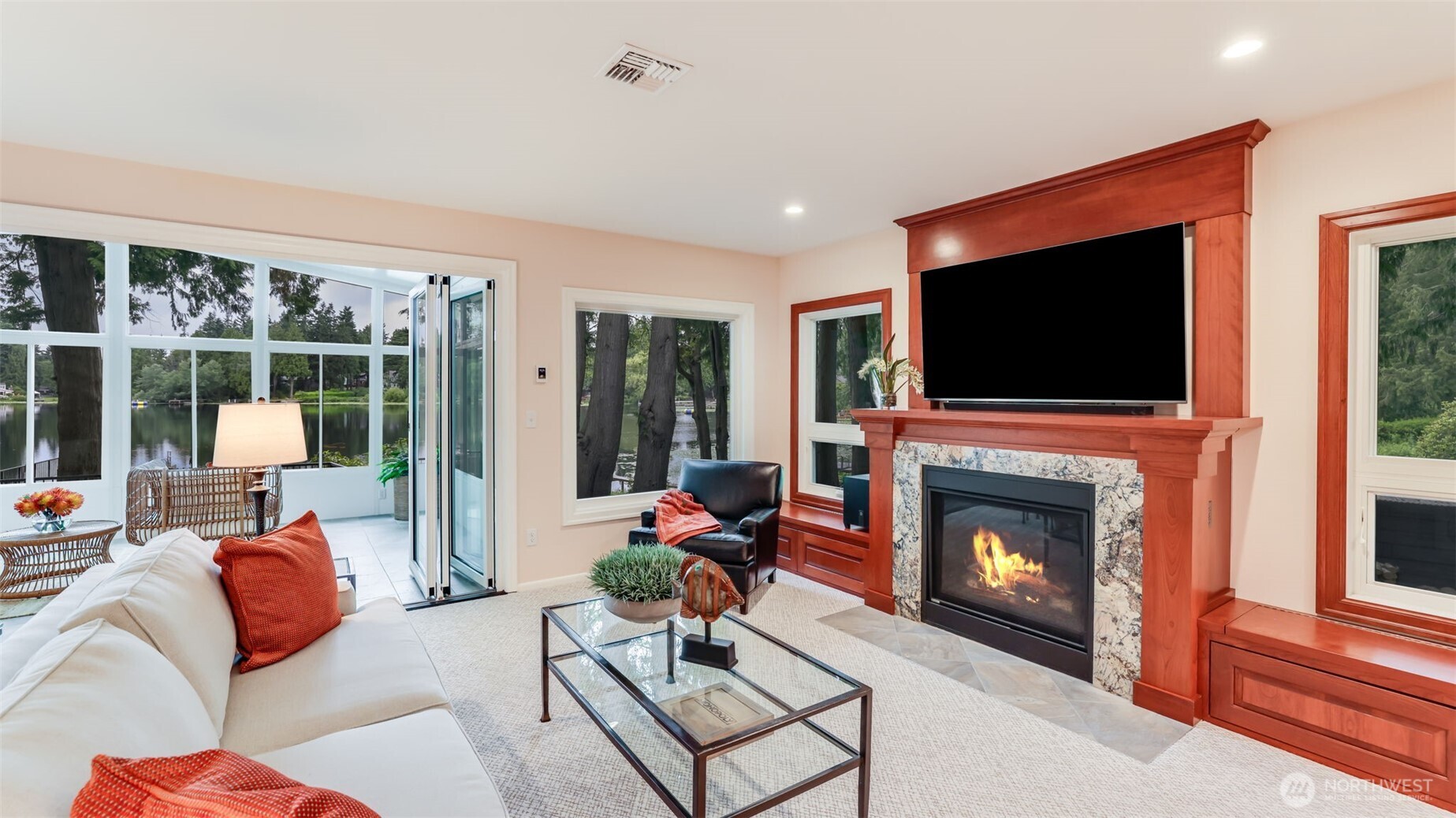 2171 North 122nd Place Seattle, WA 98133 - Photo 8 of 40 a living room with furniture a flat screen tv and a fireplace