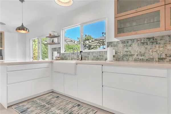 a bathroom with a window and a shower