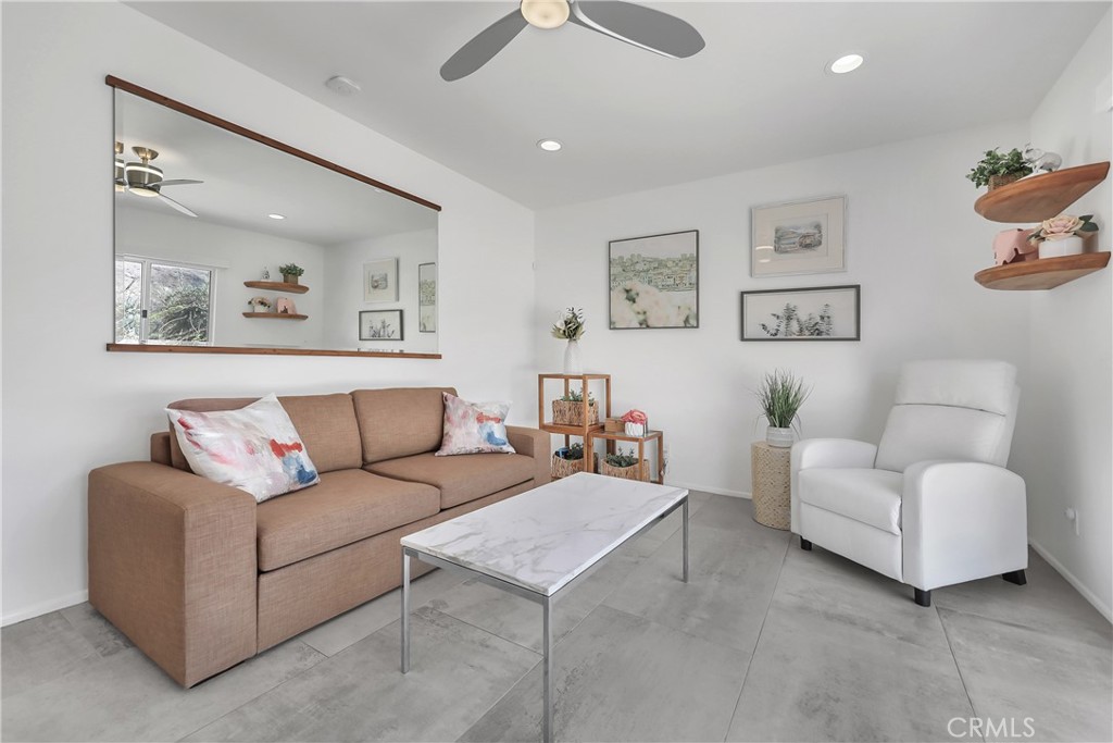 71620 Halgar Road Rancho Mirage, CA 92270 - Photo 22 of 41 a living room with furniture and a large window