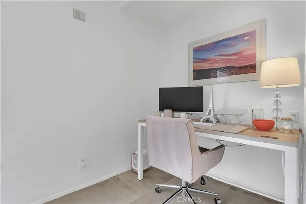 a room with furniture and a flat screen tv