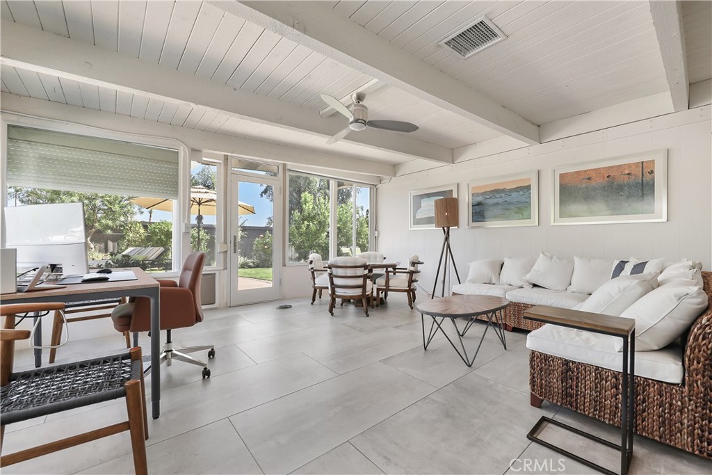 71620 Halgar Road Rancho Mirage, CA 92270 - Photo 24 of 41 a living room with furniture and a large window