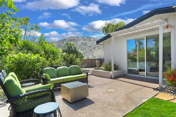 a view of a patio in the backyard