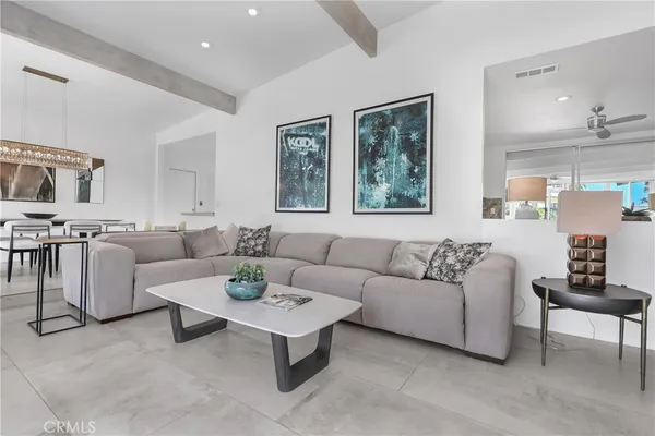 a living room with furniture and a table