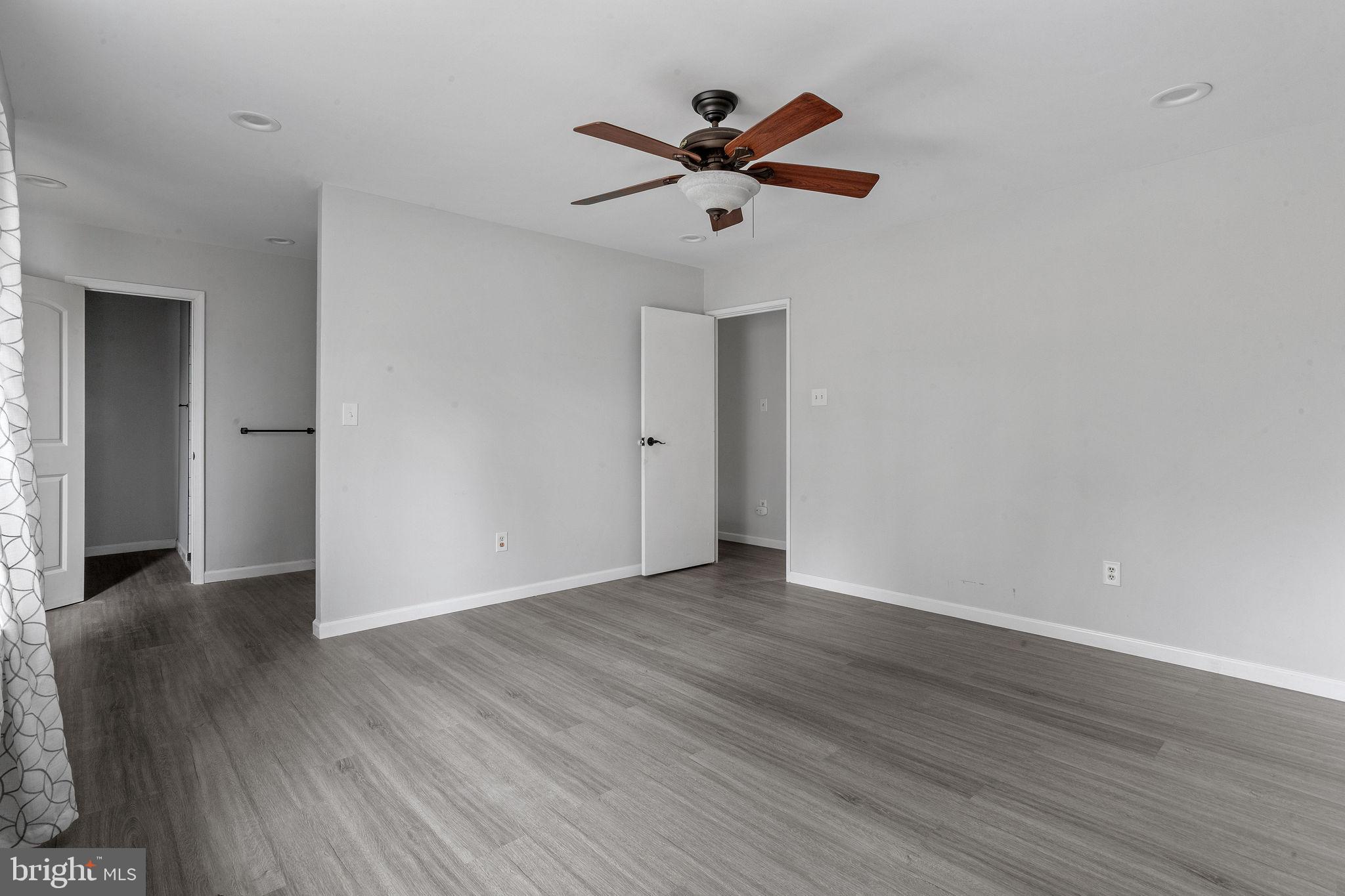 121 Aspen Court Marlton, NJ 08053 - Photo 13 of 22 a view of an empty room with wooden floor