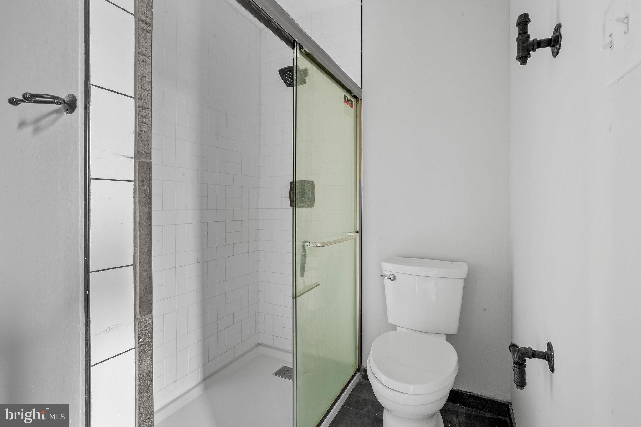 121 Aspen Court Marlton, NJ 08053 - Photo 16 of 22 a white toilet sitting next to a bathroom sink